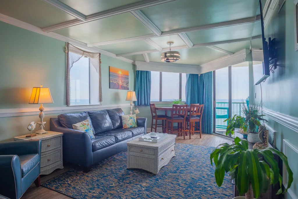 Open living room and dining area with oceanfront doors
