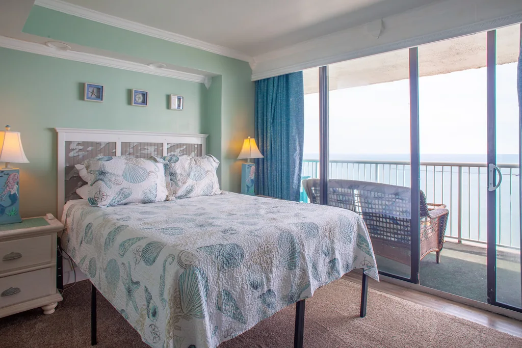 Primary queen bedroom with a door to the balcony