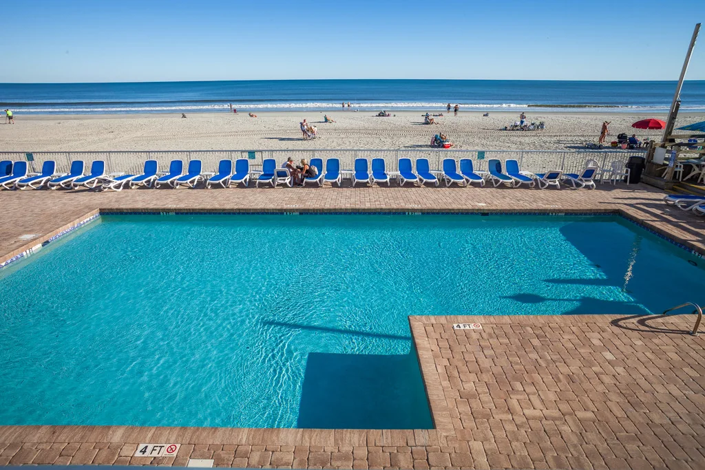 Shared oceanfront pool and beach at Sands Ocean Club