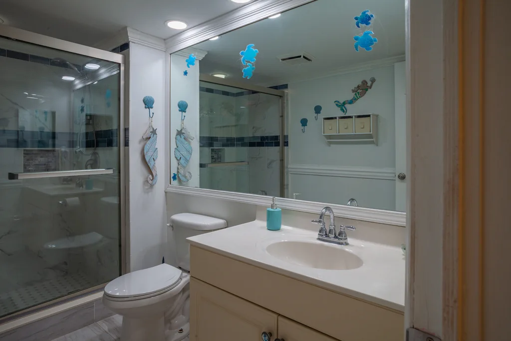 Studio bathroom vanity beside the walk-in shower